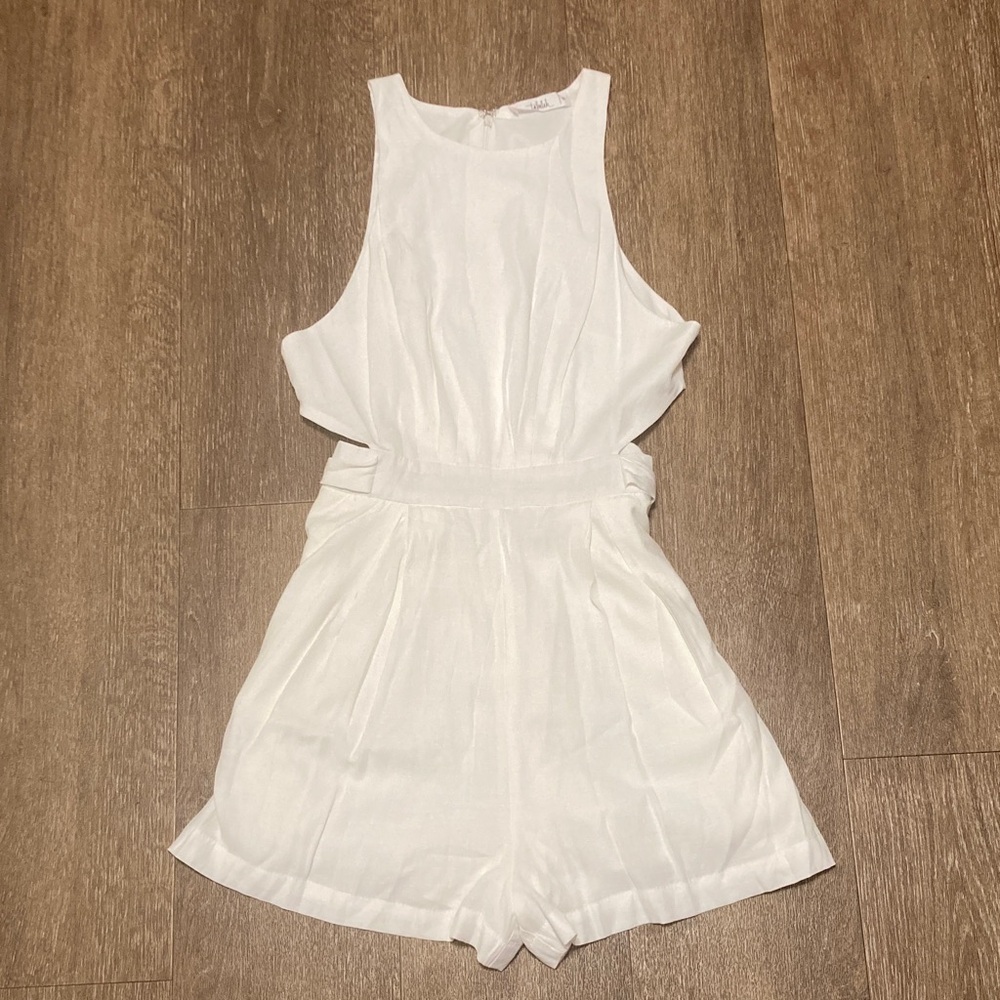 Talulah White Sleeveless One Piece Romper with side cutouts and pockets